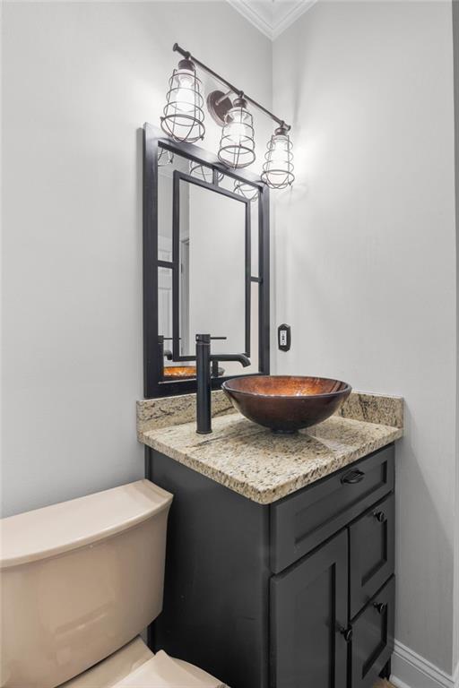 3675 Peachtree Road Northeast, Unit 45 Atlanta, GA 30319 - Photo 16 of 42 a bathroom with a granite countertop sink a toilet and mirror