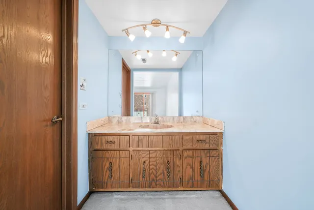 a white toilet sitting next to a shower