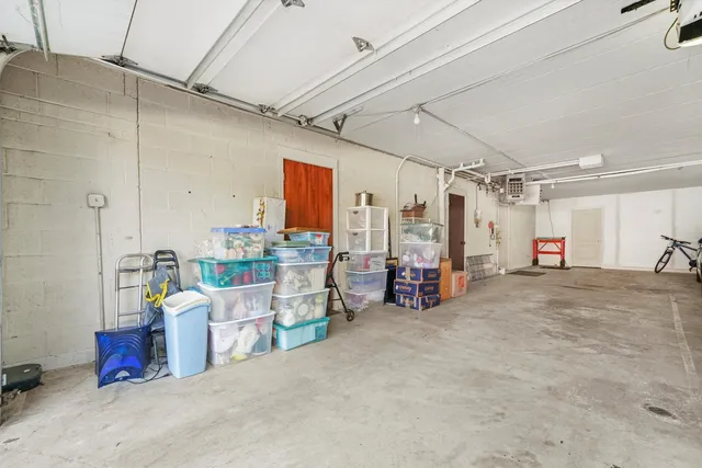 a view of a table and chairs in backyard