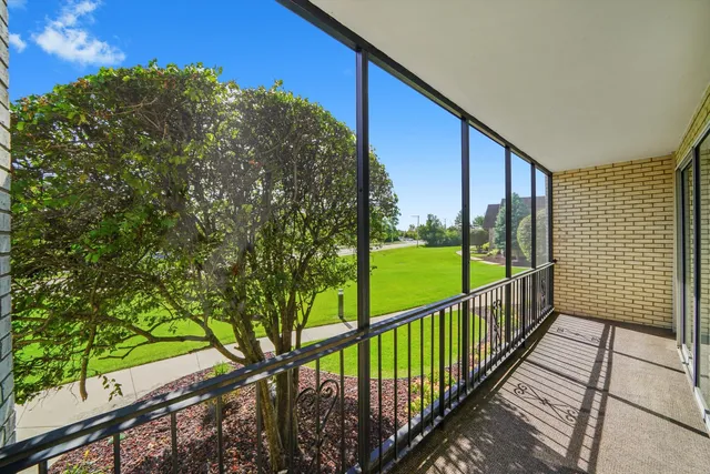 a view of balcony with yard