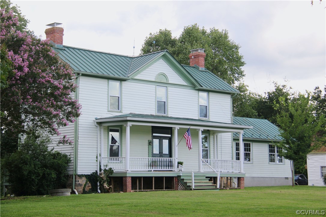 132 Carter Road Cumberland, VA 23040 - Photo 1 of 45 a front view of a house with a garden