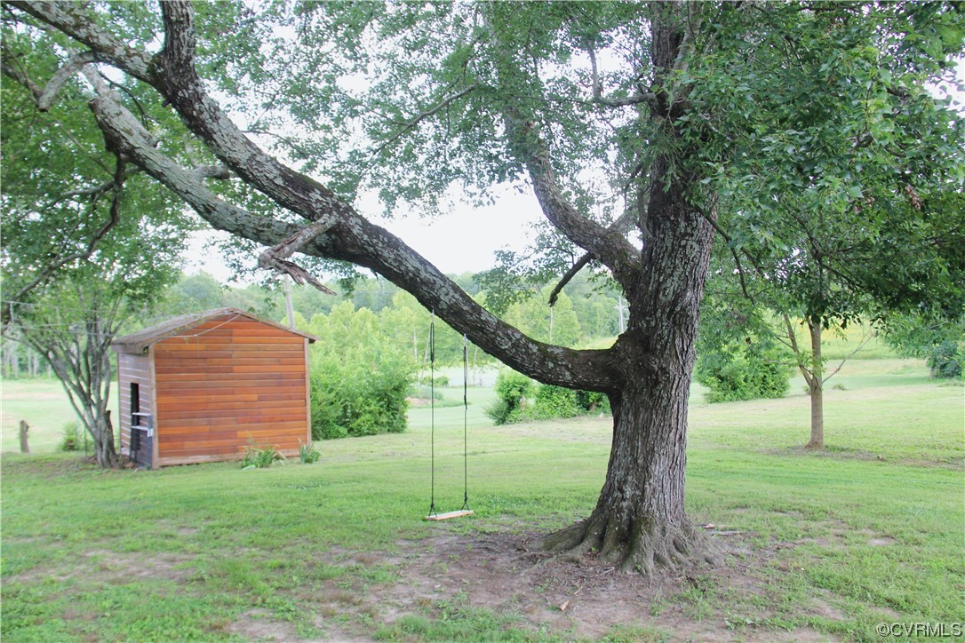 132 Carter Road Cumberland, VA 23040 - Photo 17 of 45 a view of a yard in front of a tree