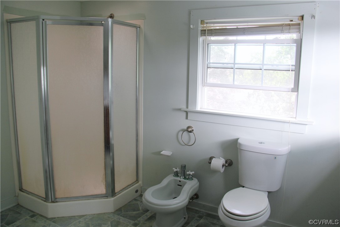 132 Carter Road Cumberland, VA 23040 - Photo 18 of 45 a white toilet sitting next to a bathroom sink