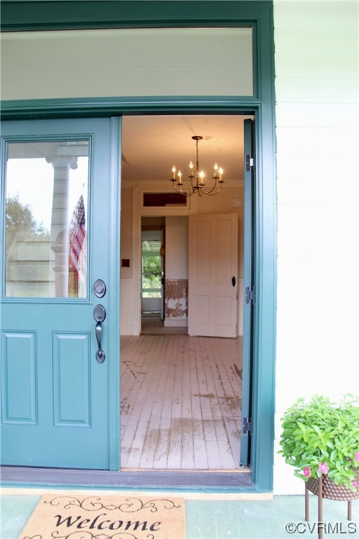 132 Carter Road Cumberland, VA 23040 - Photo 39 of 45 a view of a hallway with wooden floor and a living room