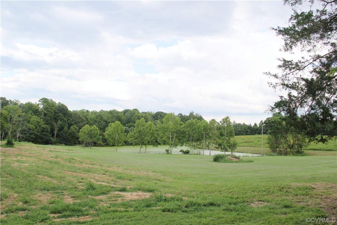 132 Carter Road Cumberland, VA 23040 - Photo 10 of 45 a view of a grassy field with trees