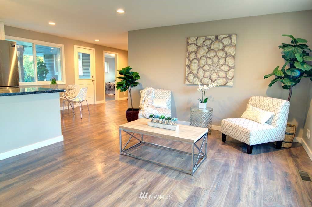 866 Queen Avenue Northeast Renton, WA 98056 - Photo 2 of 15 a living room with furniture and a large window