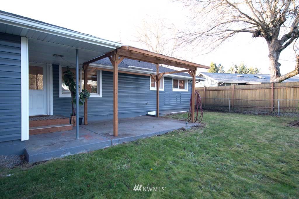 866 Queen Avenue Northeast Renton, WA 98056 - Photo 14 of 15 a view of a house with a backyard