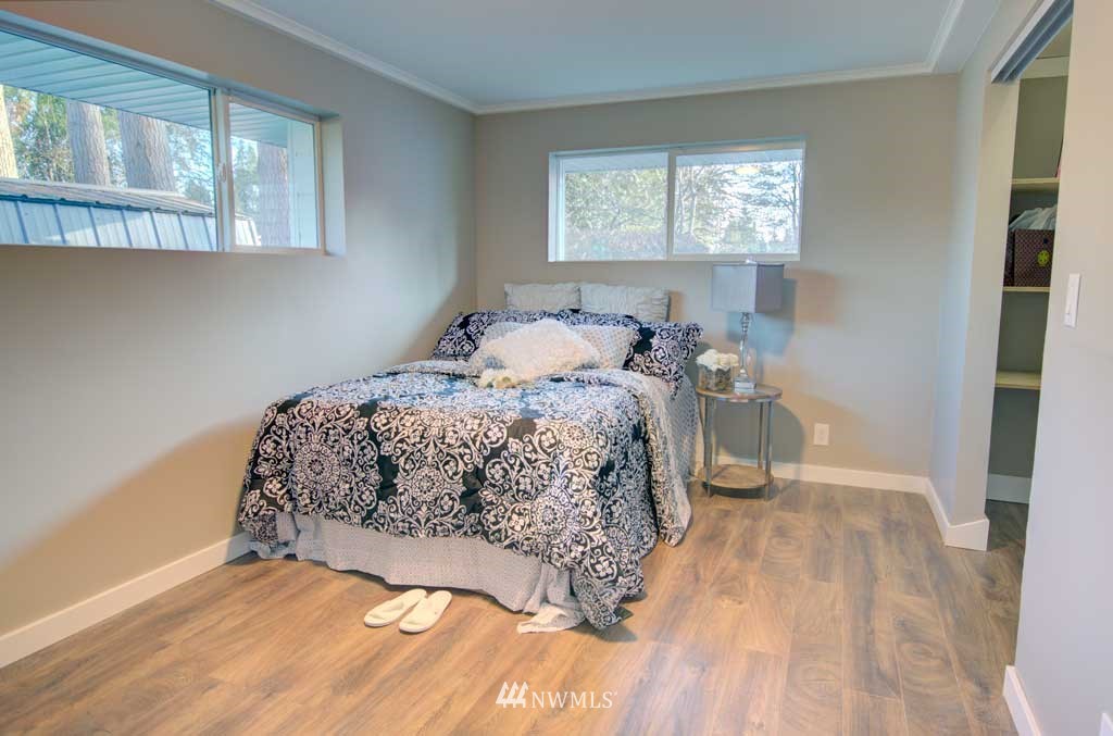 866 Queen Avenue Northeast Renton, WA 98056 - Photo 7 of 15 a bedroom with a bed and a window