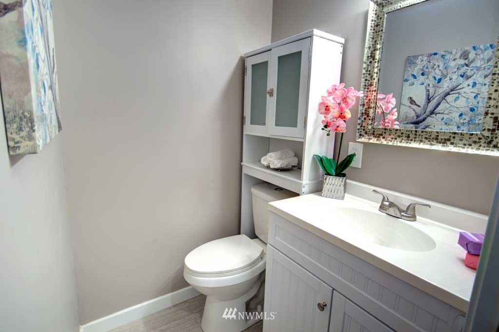 866 Queen Avenue Northeast Renton, WA 98056 - Photo 10 of 15 a bathroom with a sink vanity mirror and toilet