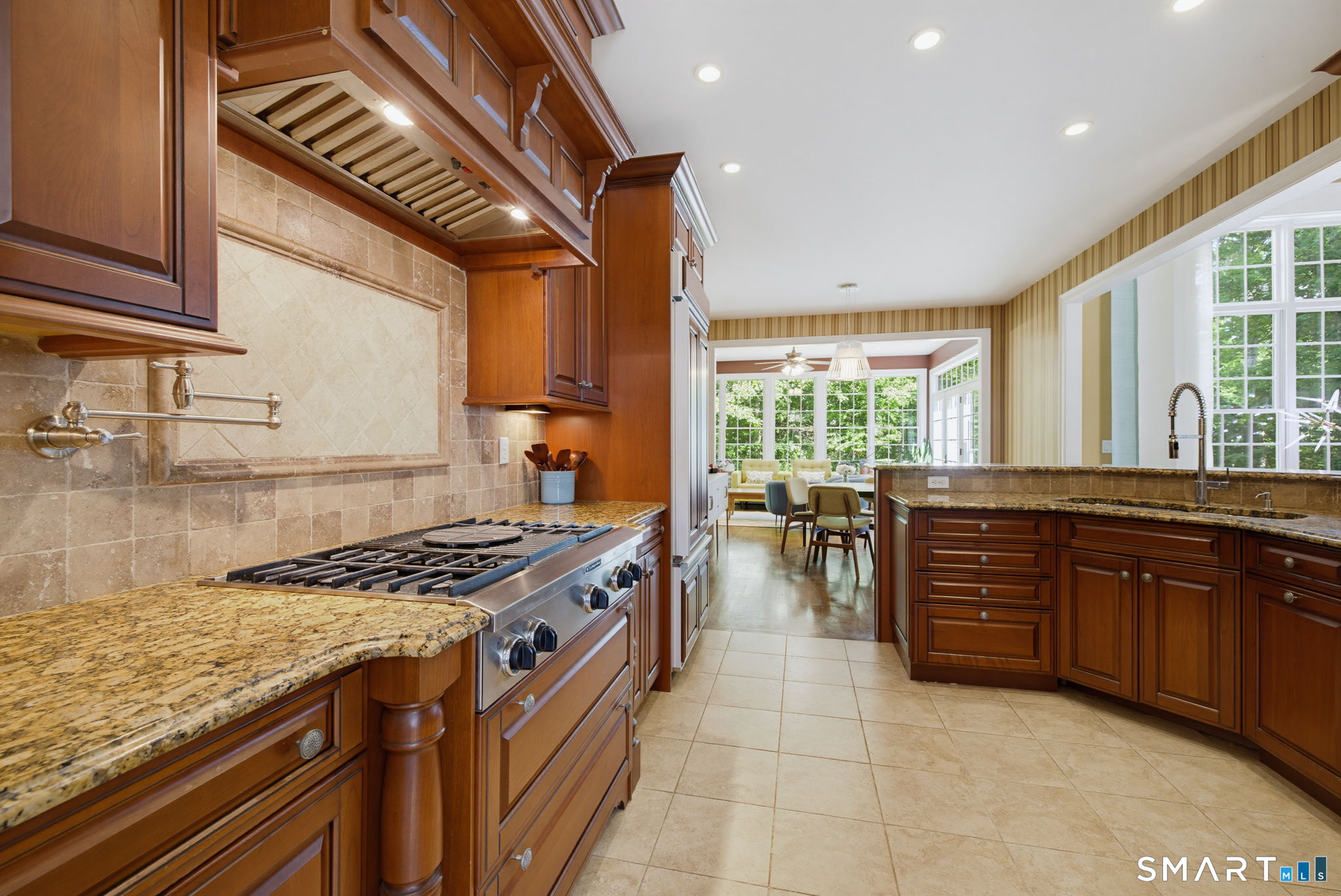 158 Appian Way Coventry, CT 06238 - Photo 18 of 40 a kitchen with stainless steel appliances granite countertop a stove a sink and a microwave