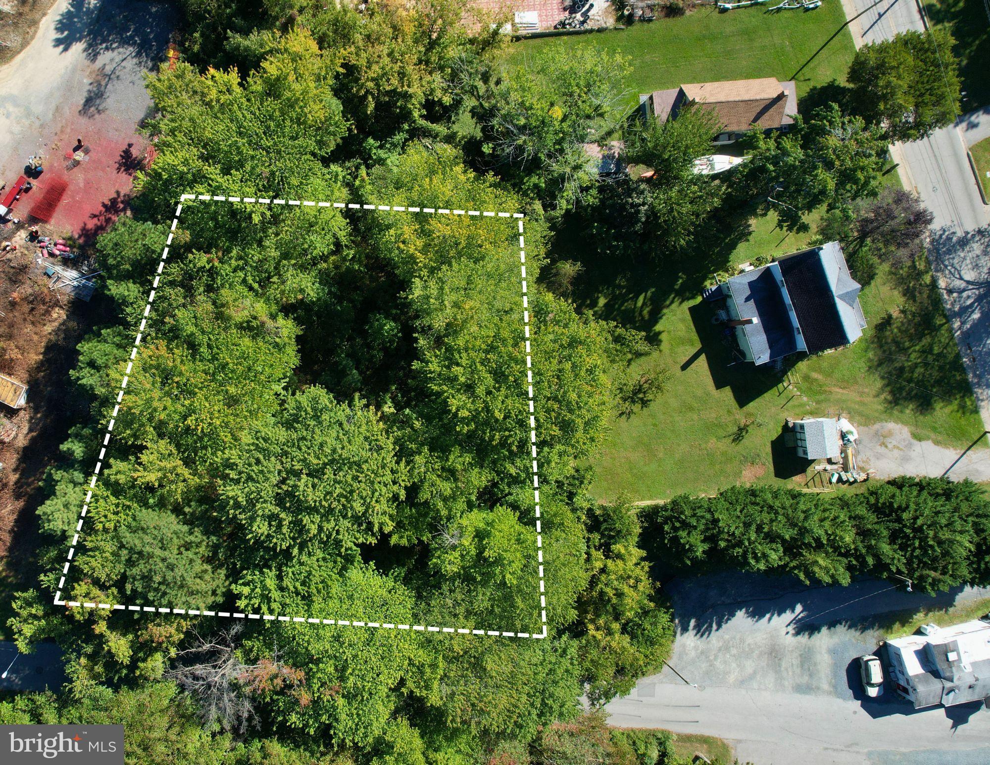 Sharp Street Rock Hall, MD 21661 - Photo 1 of 5 an aerial view of a house with yard