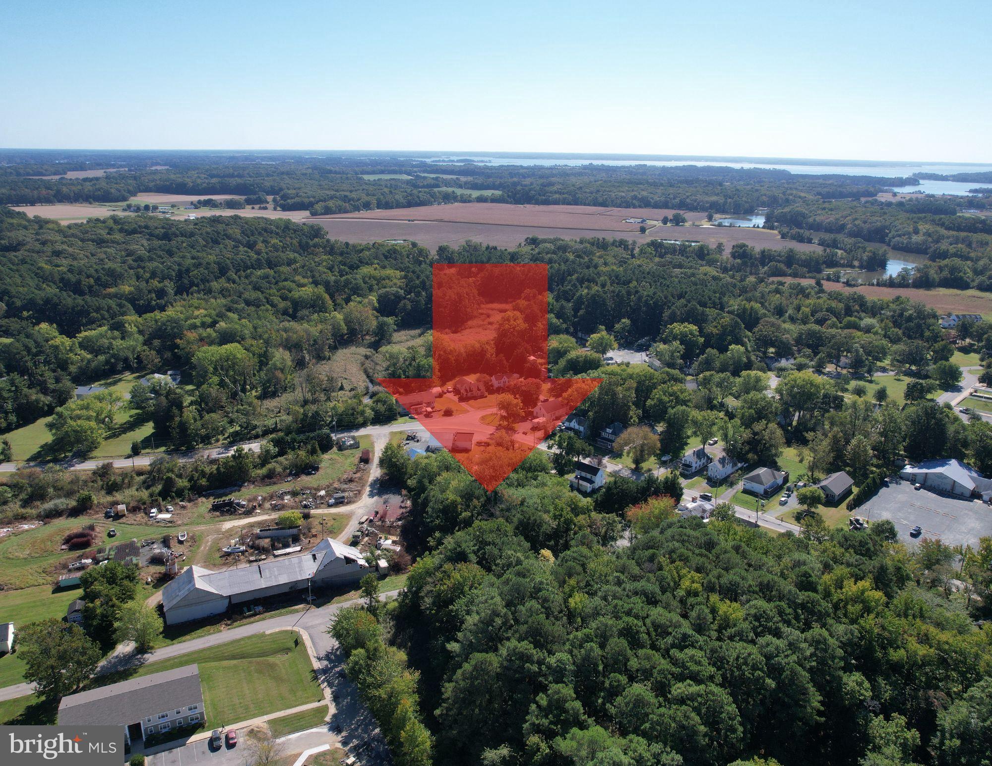Sharp Street Rock Hall, MD 21661 - Photo 2 of 5 an aerial view of a house with a garden