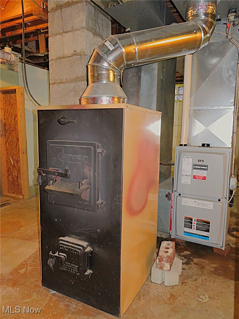 12214 Thompson Road Vermilion, OH 44089 - Photo 24 of 29 This is a whole house woodburner stove that the seller primarily used to heat his home when he was occupying it. He used the propane furnace as the secondary heat source when he was away or at work. The seller recommends having the chimney relined prior to using it again.