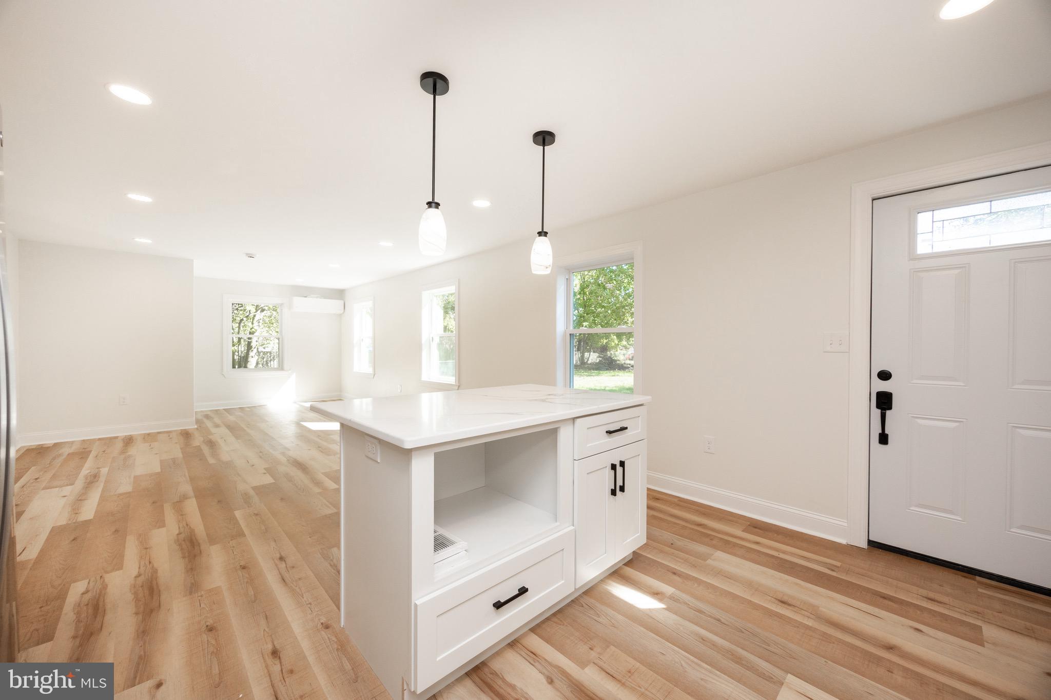 428 Adair Road Holmes, PA 19043 - Photo 17 of 59 a spacious bathroom with a granite countertop sink and a mirror