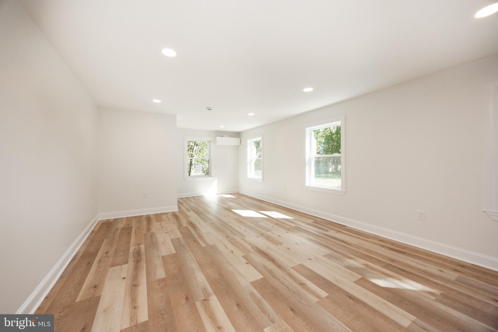 428 Adair Road Holmes, PA 19043 - Photo 18 of 59 a view of empty room with wooden floor and fan