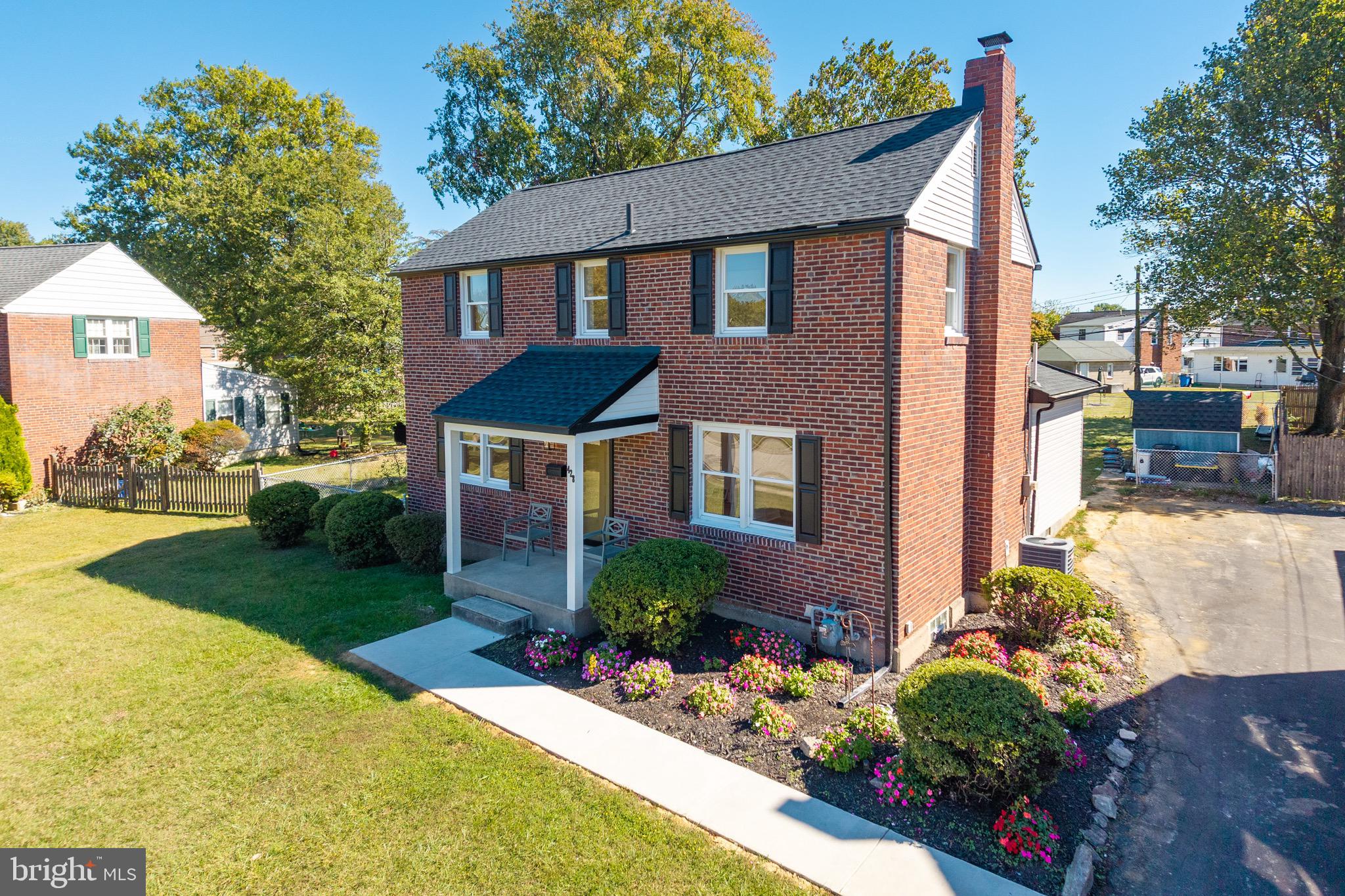 428 Adair Road Holmes, PA 19043 - Photo 2 of 59 a front view of a house with a yard and garage