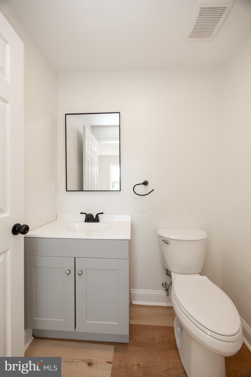 428 Adair Road Holmes, PA 19043 - Photo 21 of 59 a bathroom with a toilet a sink and mirror