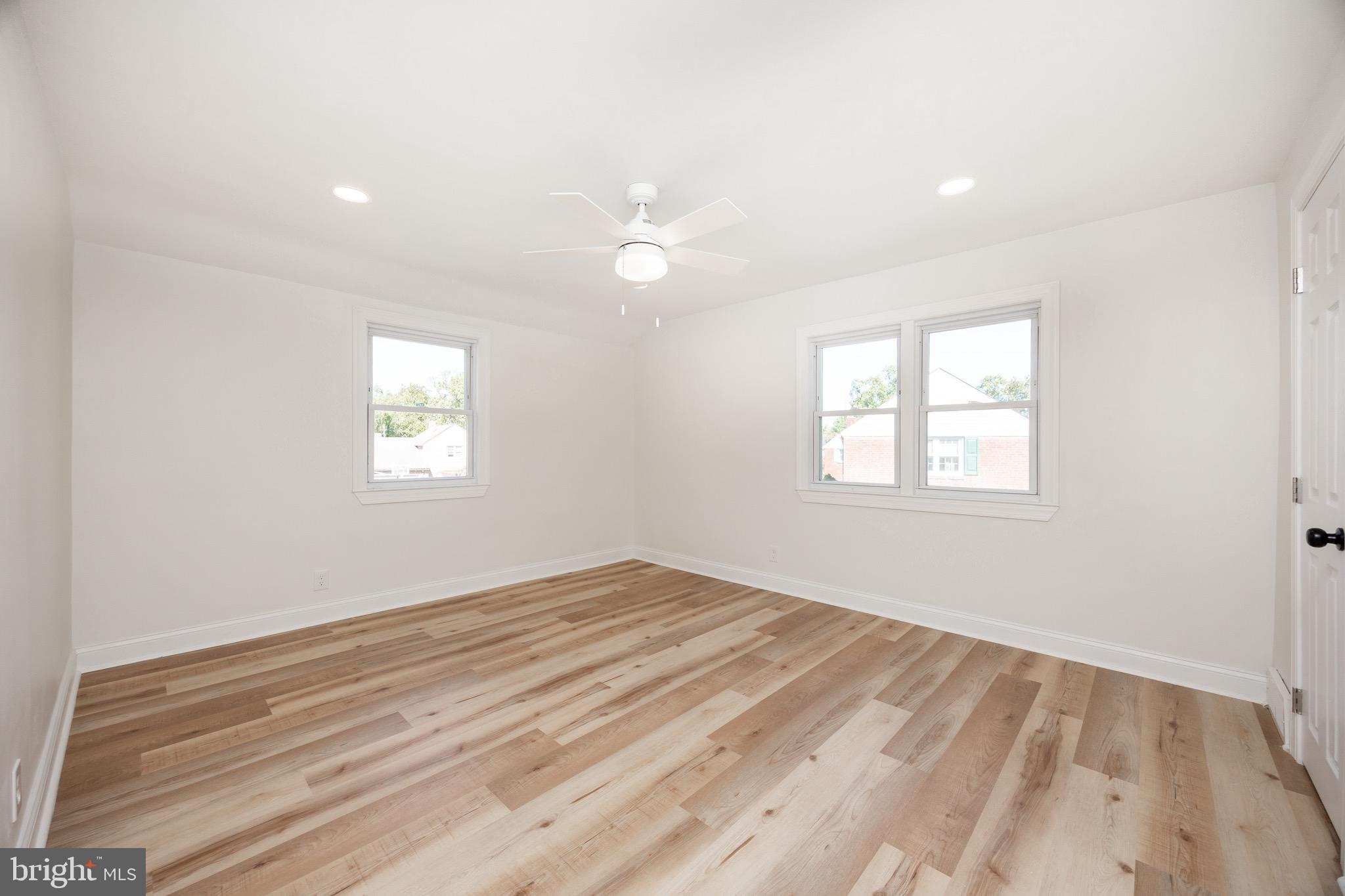 428 Adair Road Holmes, PA 19043 - Photo 31 of 59 a view of empty room with wooden floor and fan