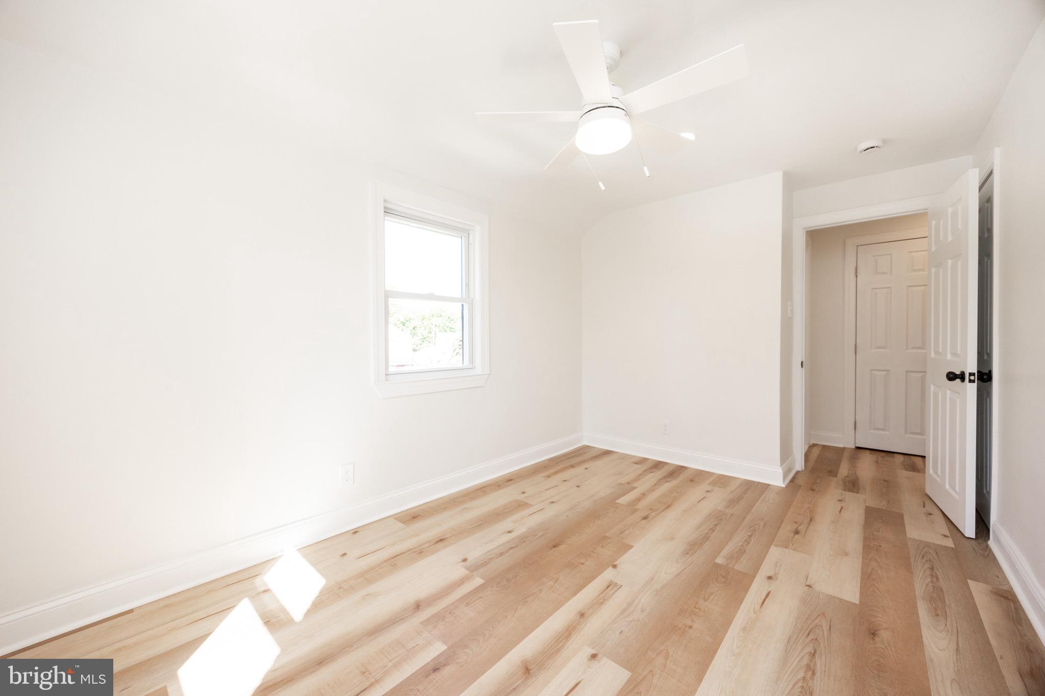 428 Adair Road Holmes, PA 19043 - Photo 34 of 59 a view of an empty room and wooden floor