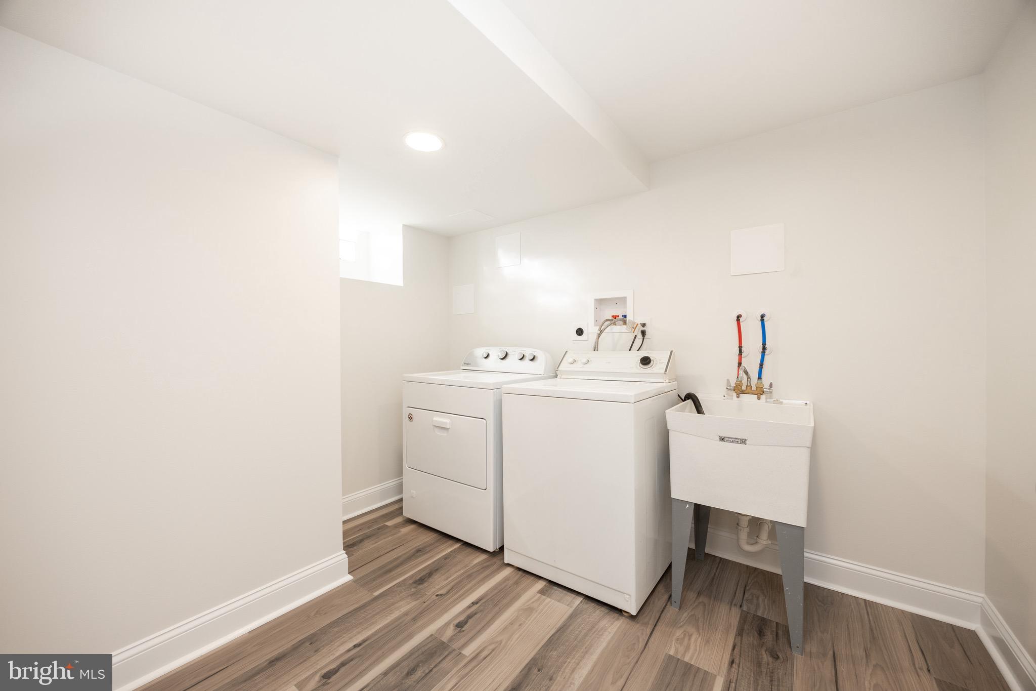 428 Adair Road Holmes, PA 19043 - Photo 37 of 59 a utility room with cabinets washer and dryer