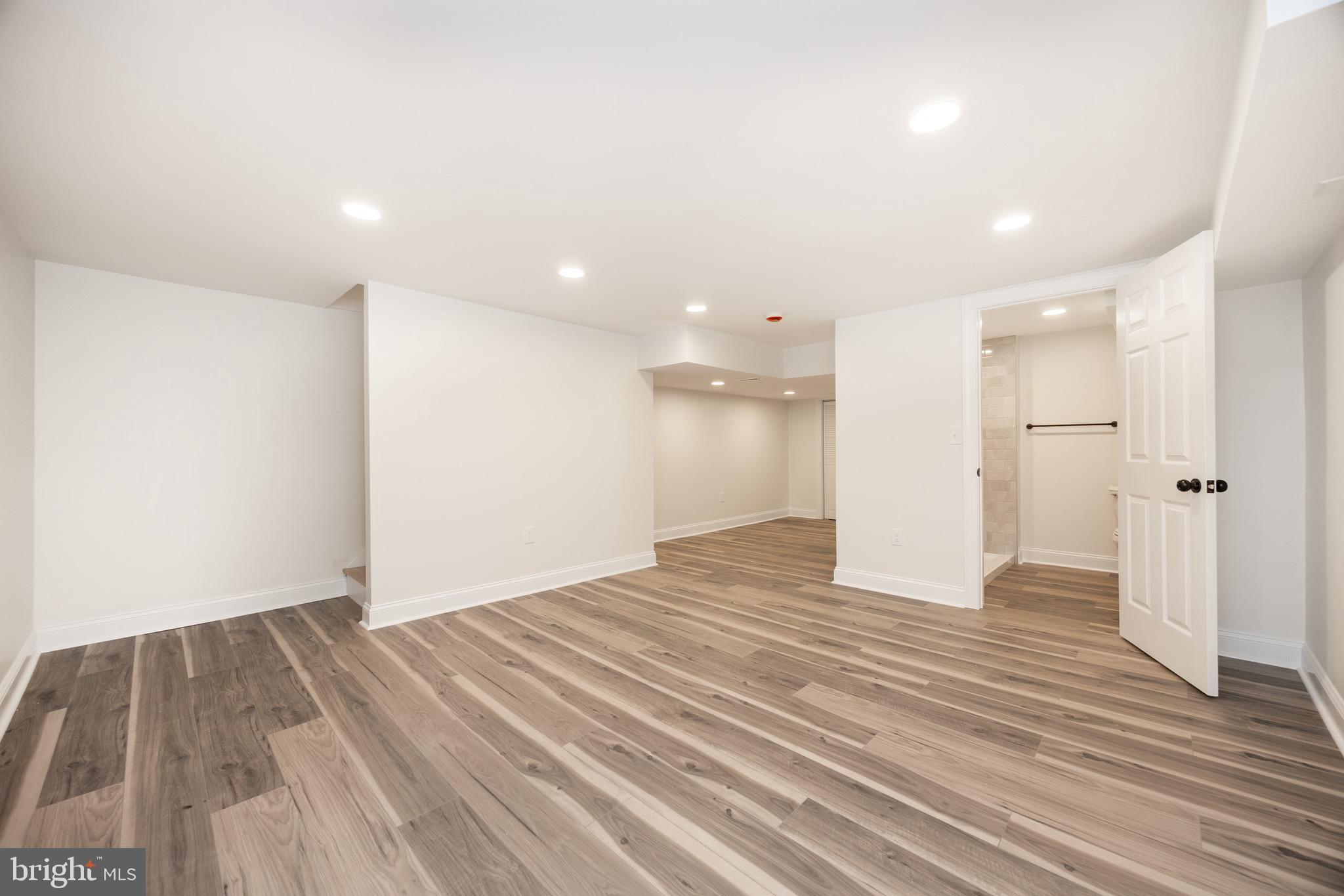 428 Adair Road Holmes, PA 19043 - Photo 38 of 59 a view of an empty room with wooden floor