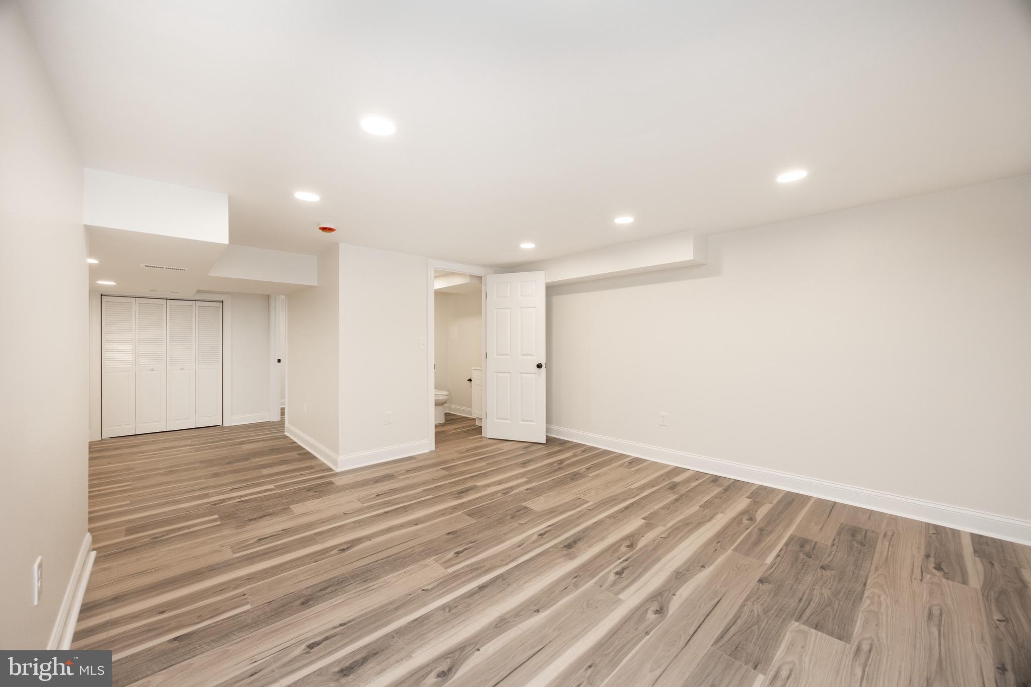 428 Adair Road Holmes, PA 19043 - Photo 39 of 59 a view of an empty room with wooden floor