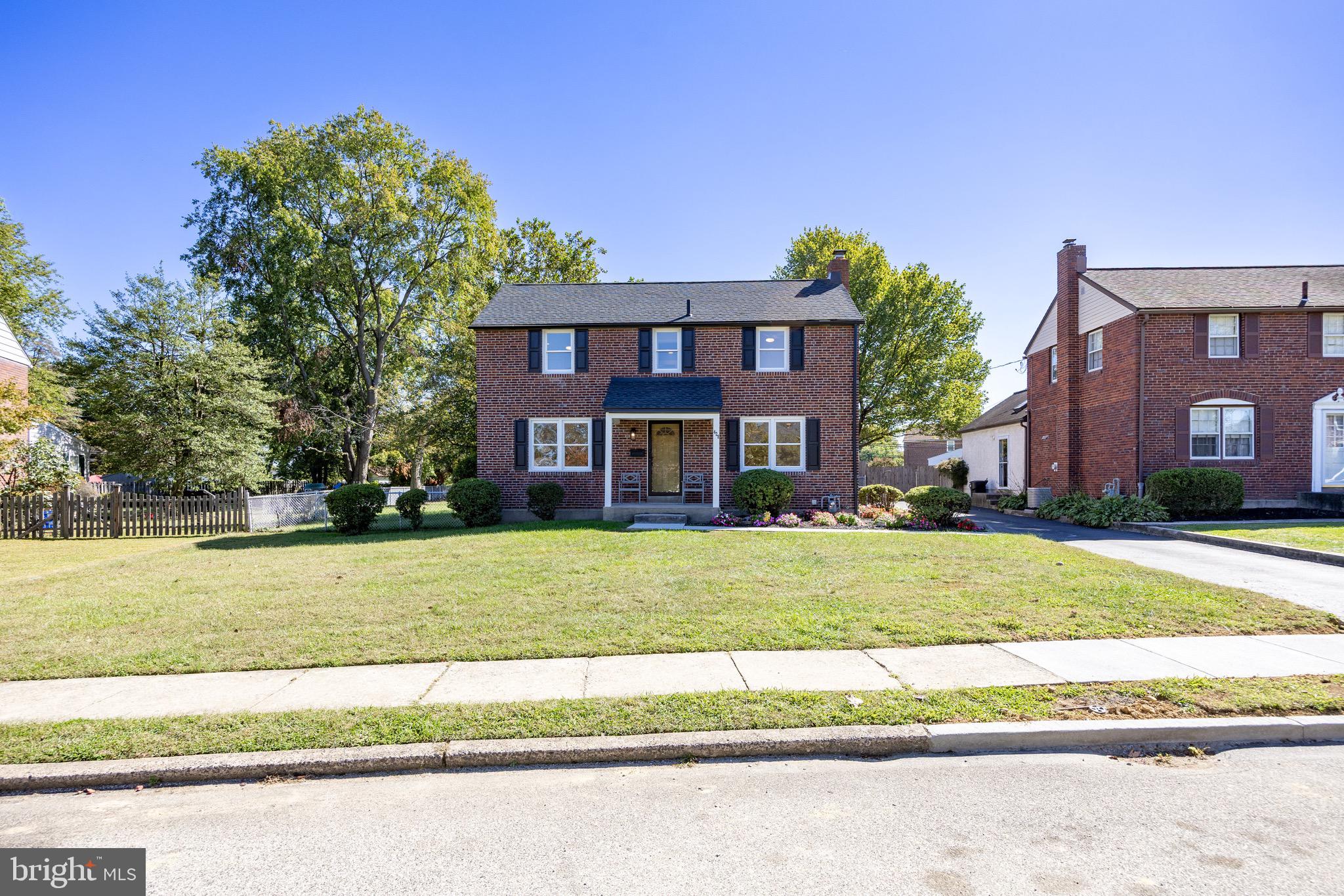428 Adair Road Holmes, PA 19043 - Photo 54 of 59 a view of a big house with a big yard and large trees
