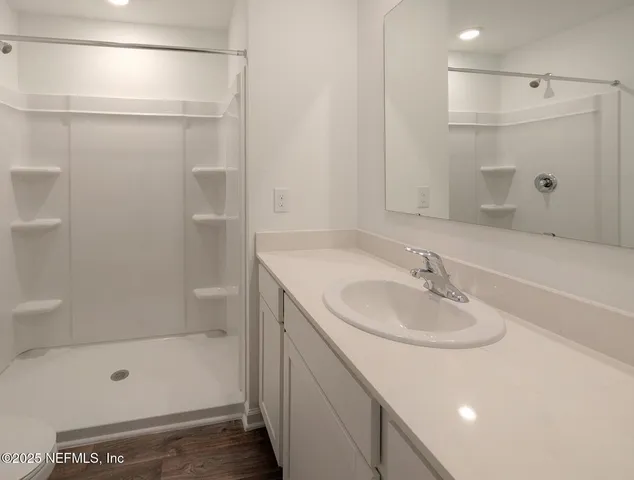 a bathroom with a sink shower and a bathtub