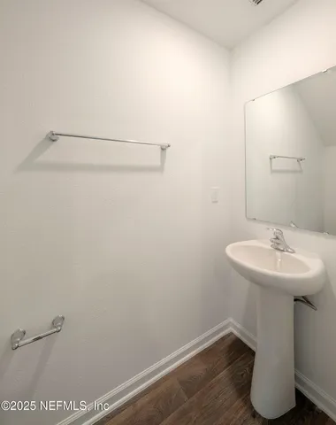 a bathroom with a sink and mirror