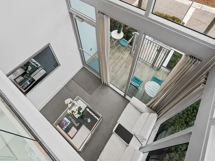 a view of living room and wooden floor