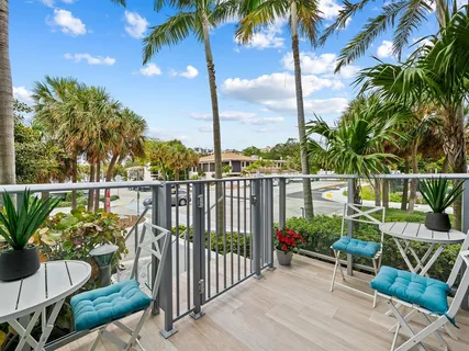a view of a balcony with chairs