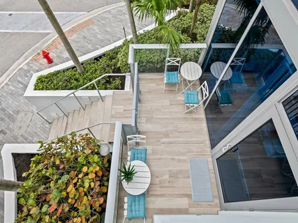 a view of a swimming pool with an outdoor seating