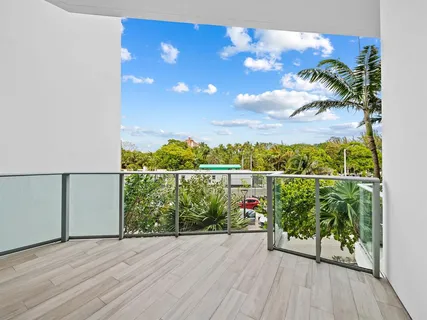 a living room with furniture and a painting