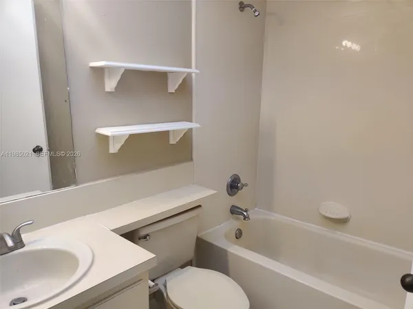 a bathroom with a sink toilet and bathtub