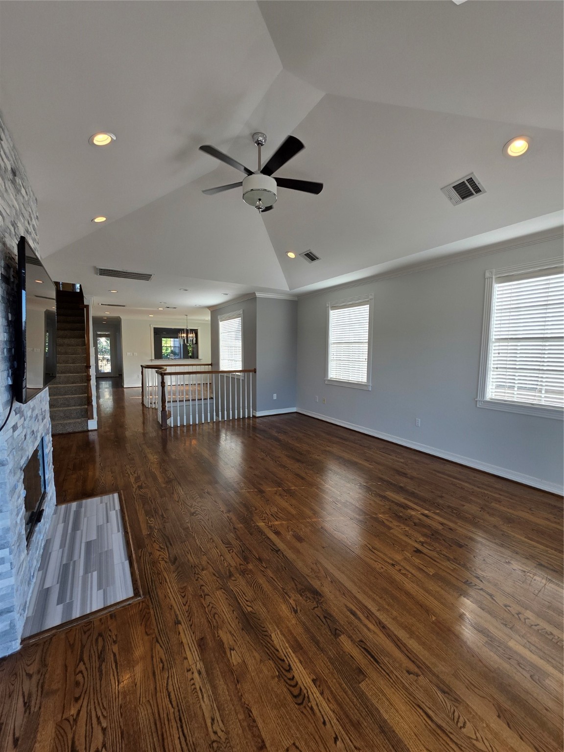 1714 Roy Street Houston, TX 77007 - Photo 28 of 35 a view of a livingroom with furniture a ceiling fan and wooden floor