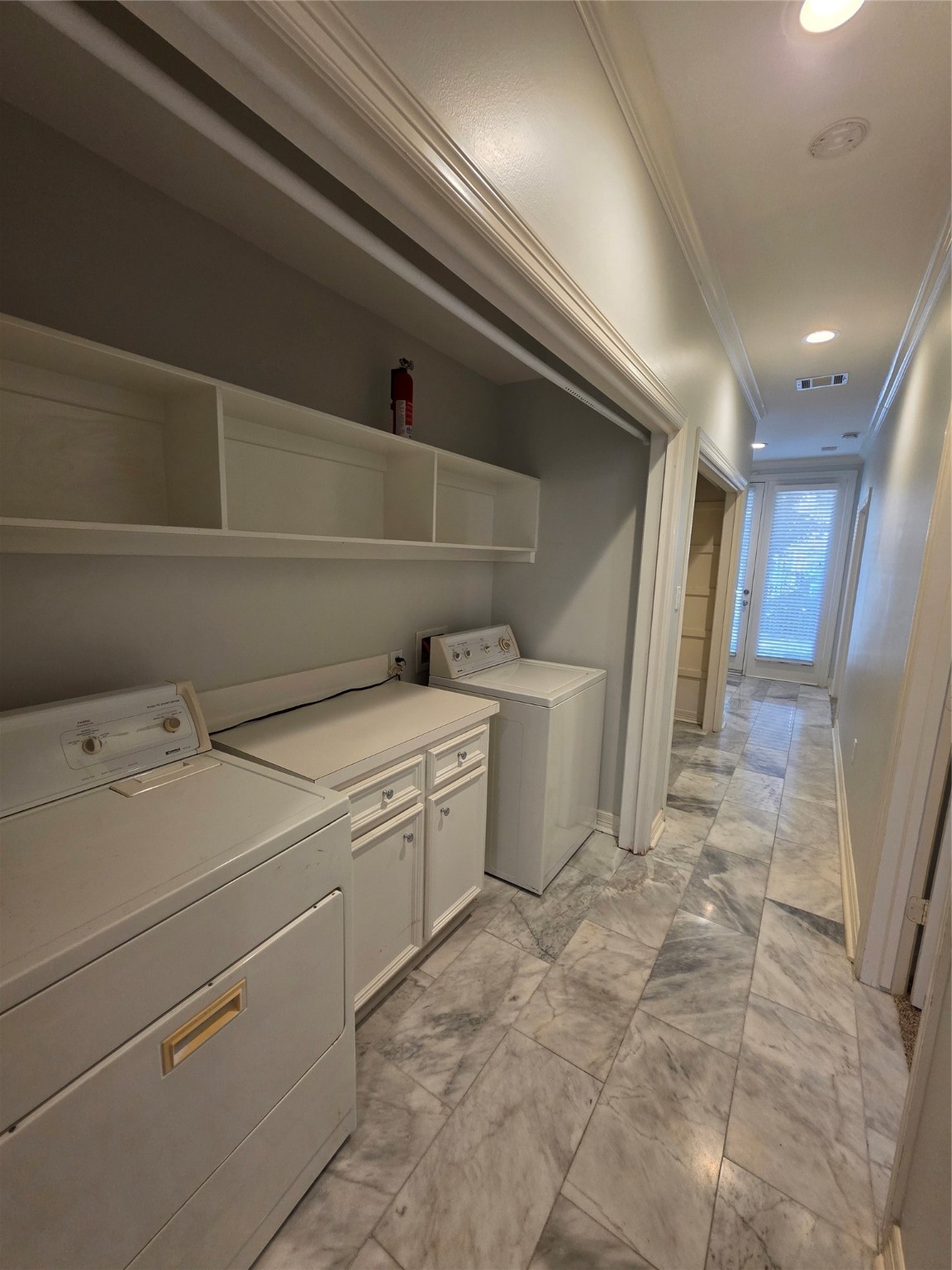 1714 Roy Street Houston, TX 77007 - Photo 31 of 35 a view of storage and utility room with washer and dryer