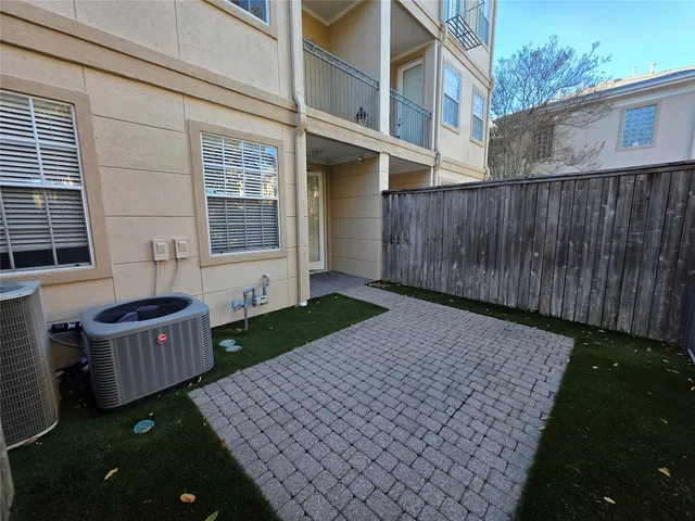 a view of a street with a tree