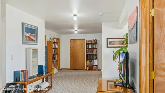 a view of a bedroom with gym equipment