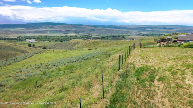 a view of an ocean and a mountain
