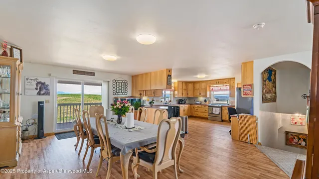a view of a dining room with furniture window and wooden floor