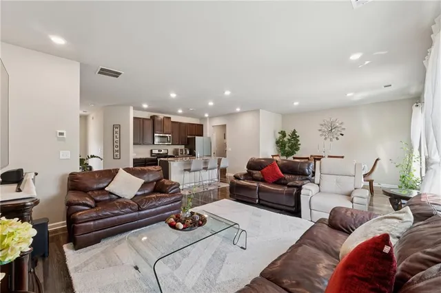 a living room with furniture or wooden floor and a table