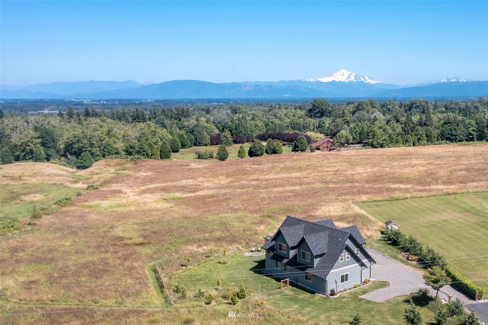6780 Olson Road Ferndale, WA 98248 - Photo 1 of 40 a view of a lake with sunset