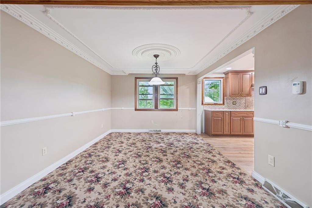22 Buzzardtown Road Irwin, PA 15642 - Photo 11 of 44 a view of a bedroom with wooden floor and windows