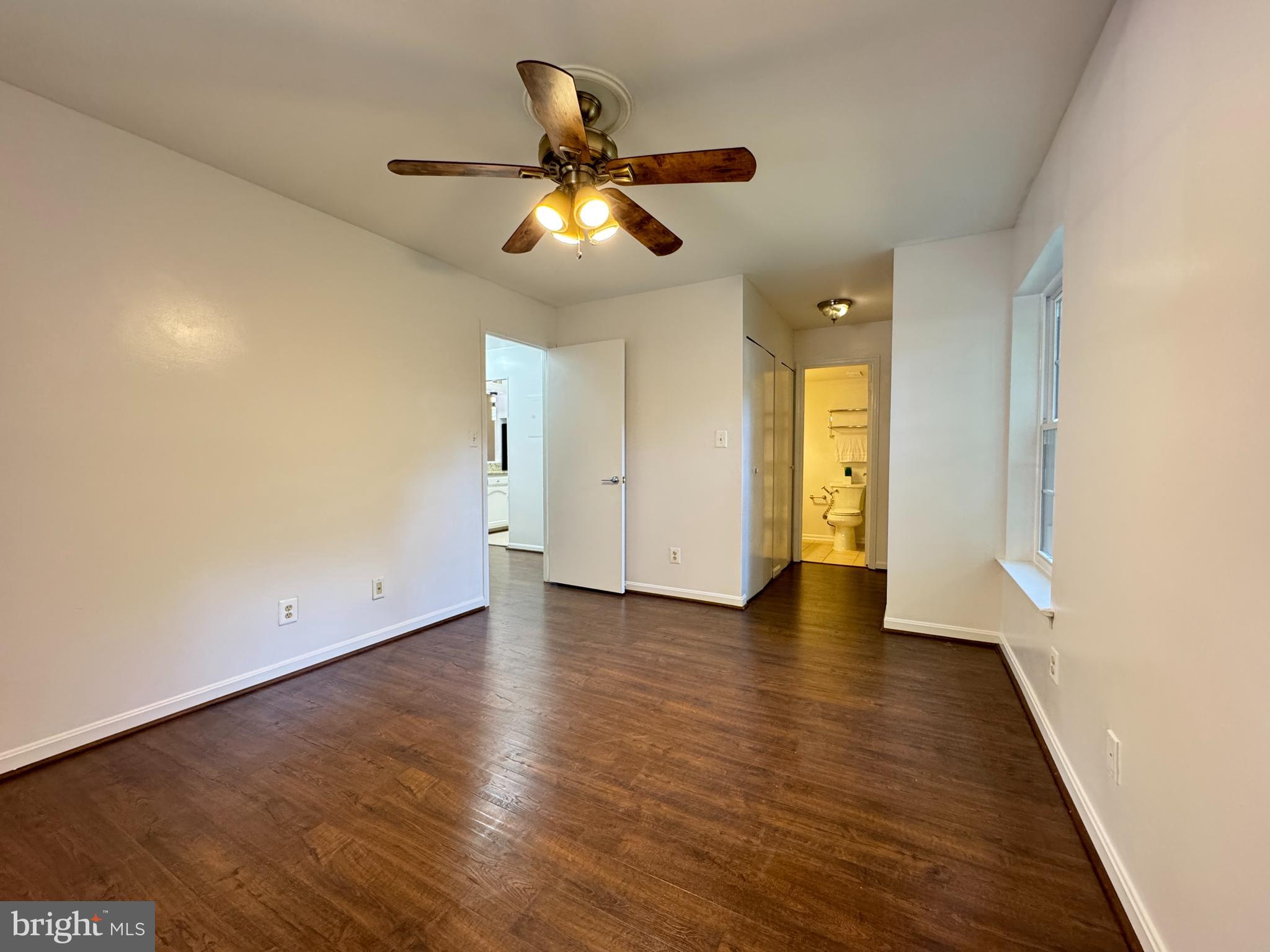 5916 Cove Landing Road, Unit 204 Burke, VA 22015 - Photo 16 of 20 a view of an empty room with wooden floor