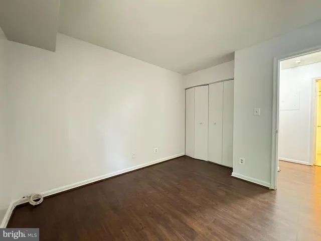 an empty room with wooden floor