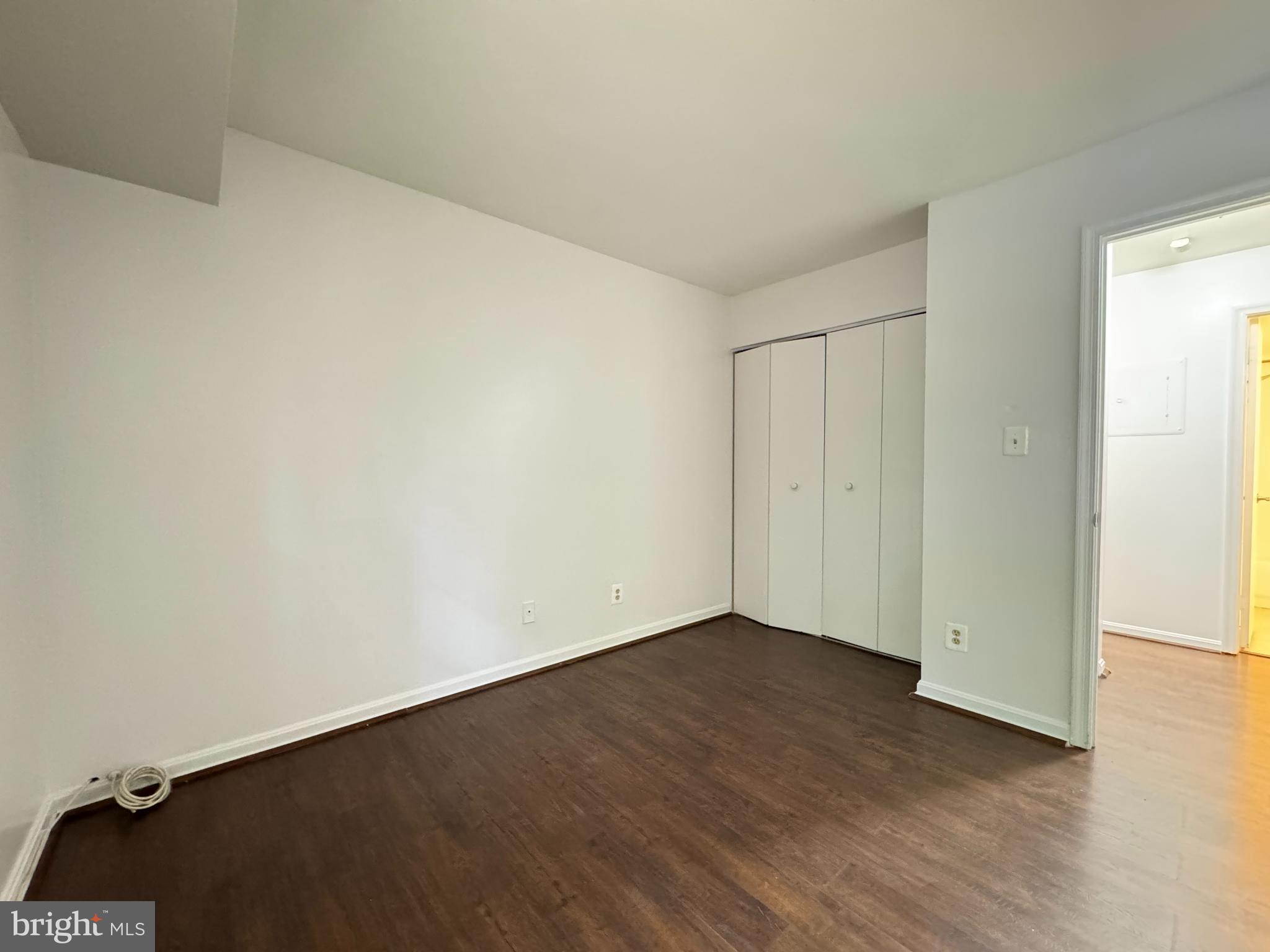 5916 Cove Landing Road, Unit 204 Burke, VA 22015 - Photo 19 of 20 an empty room with wooden floor