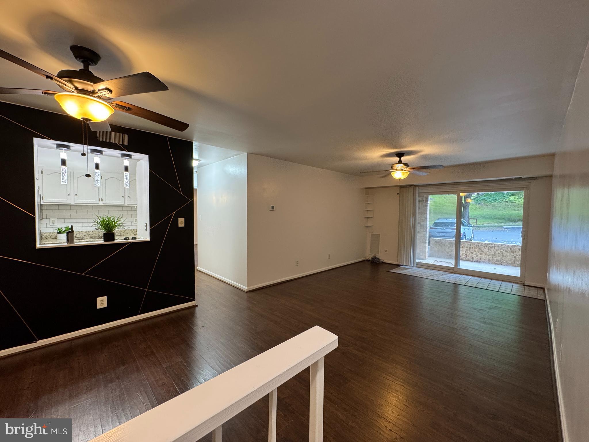 5916 Cove Landing Road, Unit 204 Burke, VA 22015 - Photo 2 of 20 a view of room with window and wooden floor