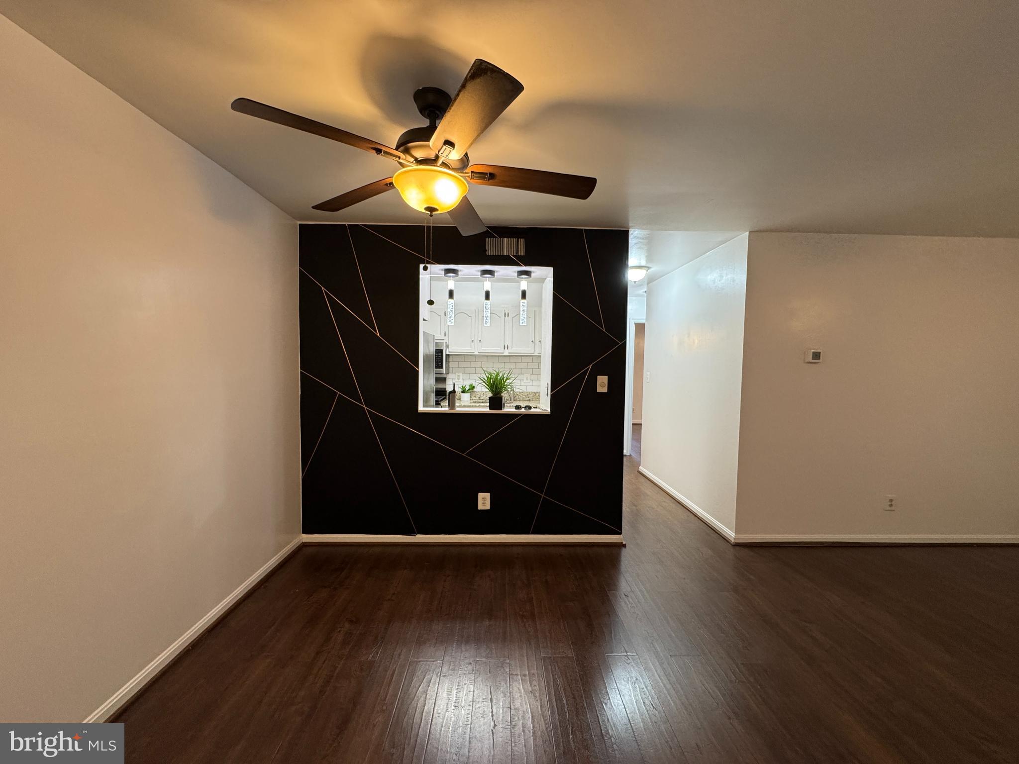 5916 Cove Landing Road, Unit 204 Burke, VA 22015 - Photo 4 of 20 a view of a living room with wooden floor
