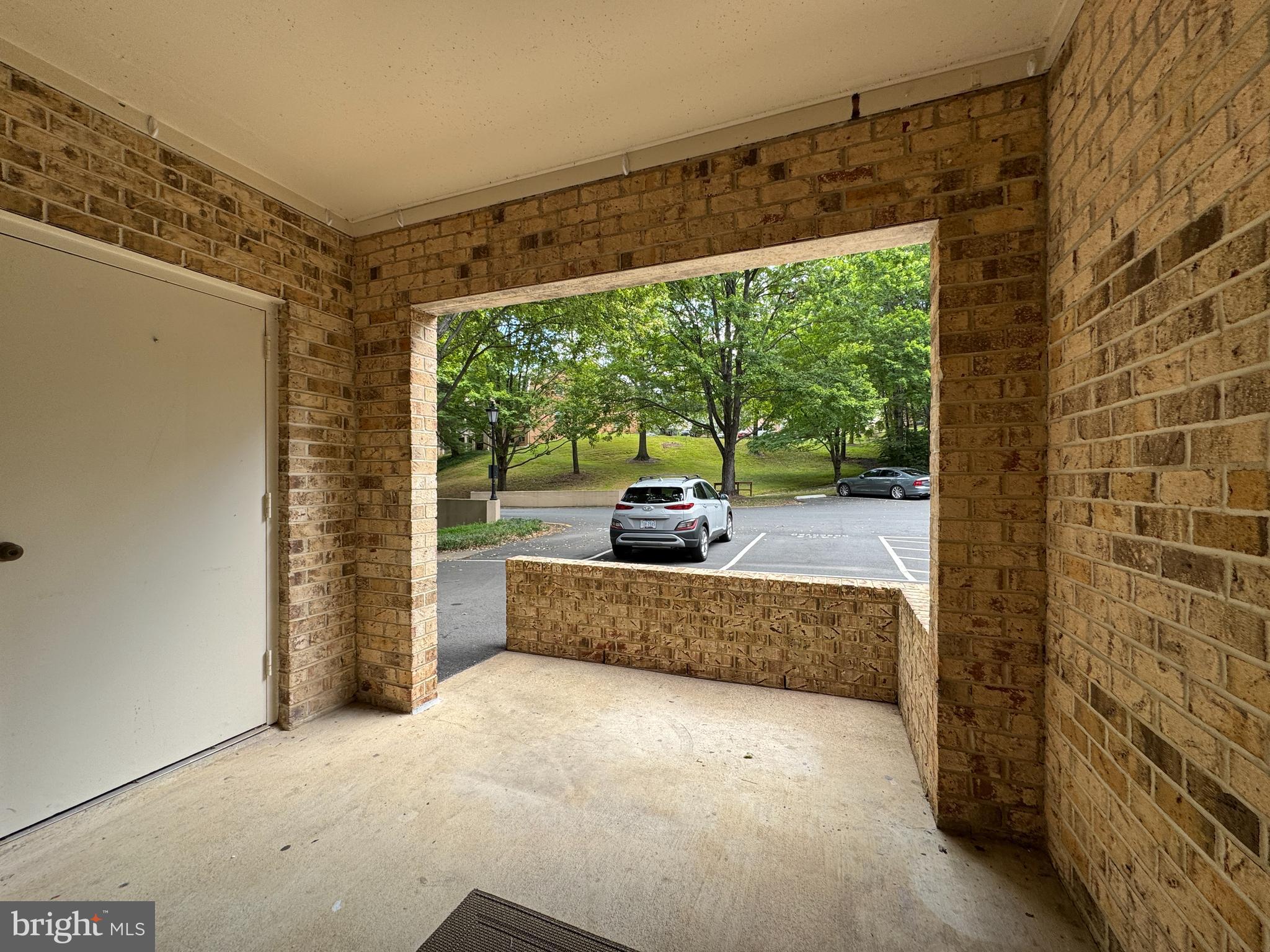 5916 Cove Landing Road, Unit 204 Burke, VA 22015 - Photo 8 of 20 a living room with a large window and a table