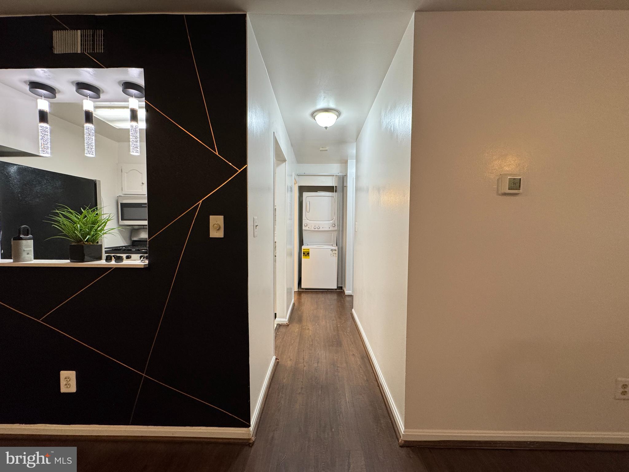 5916 Cove Landing Road, Unit 204 Burke, VA 22015 - Photo 10 of 20 a view of a hallway with wooden floor and staircase